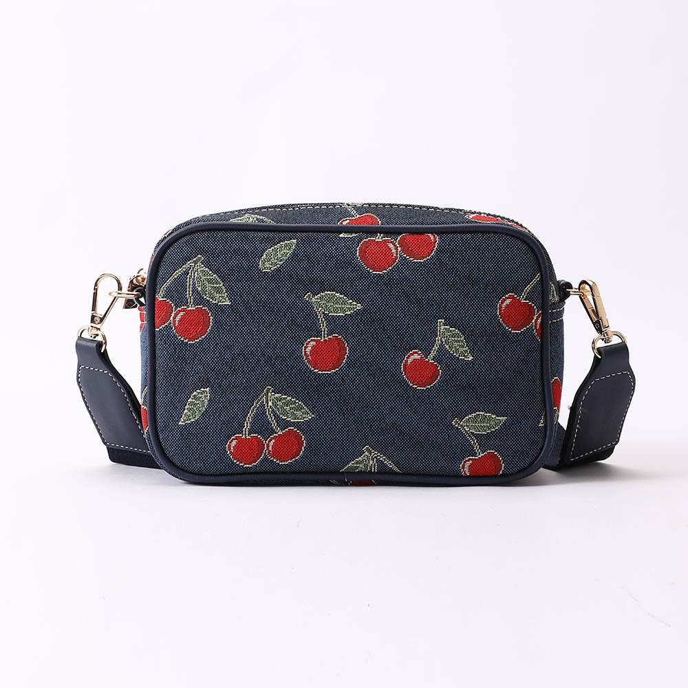 Cherry Camera Crossbody Bag on Blue Backdrop